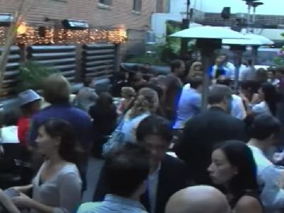 A huge number of people are gathered and are chatting.